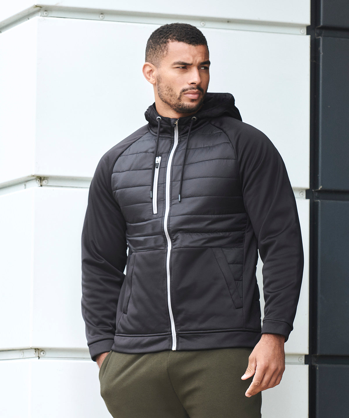 Black - Unisex padded sports jacket - GarmentEmbroidery